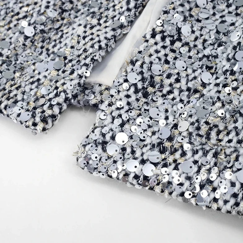 Stylish sequin women's silver jacket close up fabric
