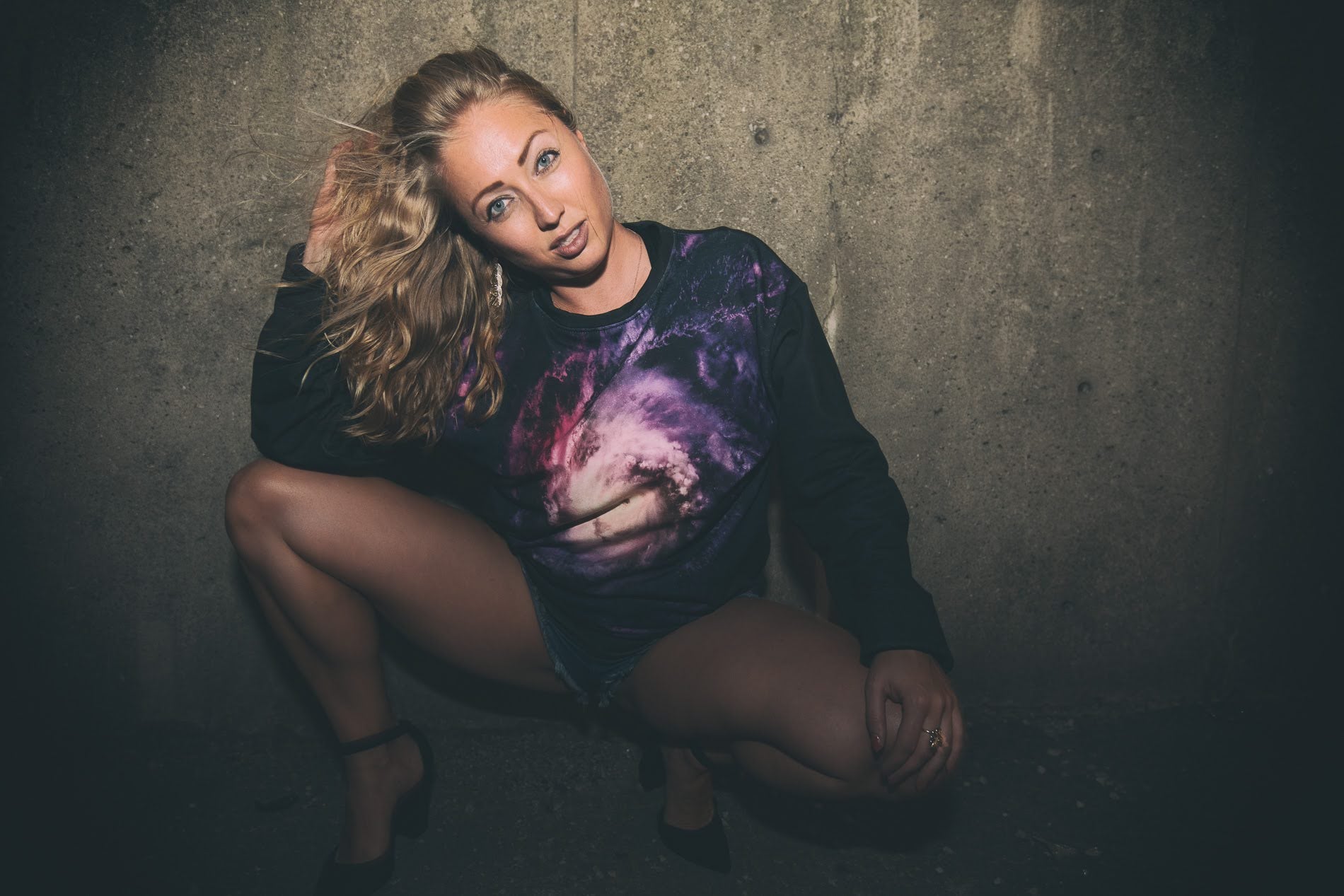 Blond girl wears galaxy sweater streetwear style festival