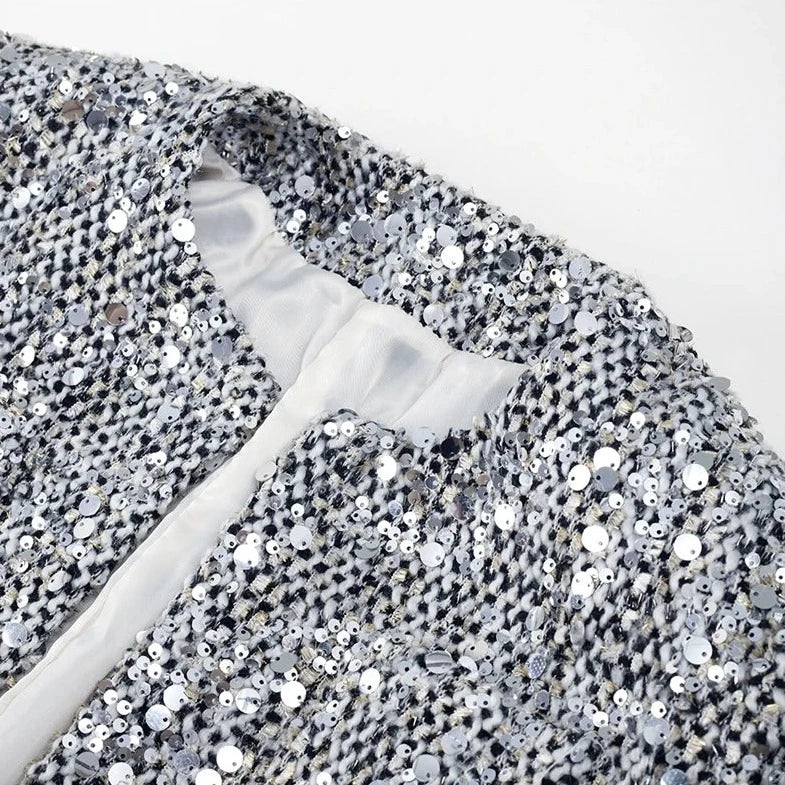 Stylish sequin women's silver jacket close up neckline